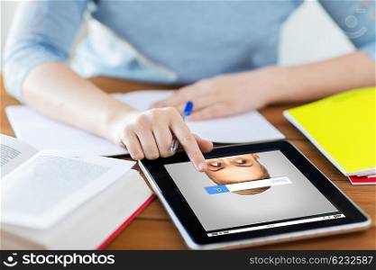 business, education, people and technology concept - close up of student woman with internet browser search bar on tablet pc computer and notebook at home