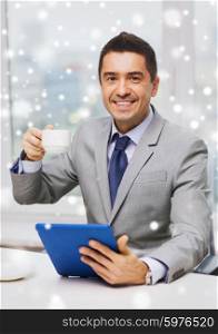 business, education, people and technology concept - smiling businessman with tablet pc computer and coffee in office over snow effect
