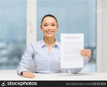 business, education, school, documents, people, legal and real estate concept - happy businesswoman holding contract in office