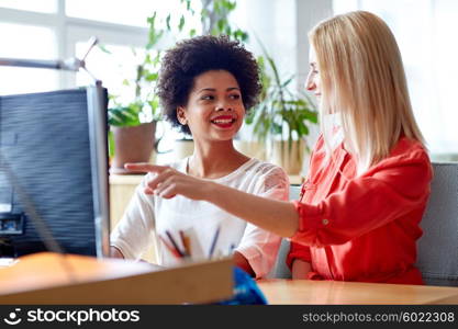 business, education, startup and people concept - happy women or students with computer in office