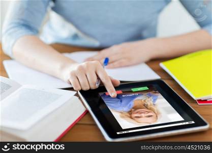 business, education, technology and communication concept - close up of student woman with incoming call on tablet pc computer and notebook at home