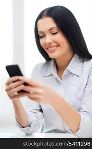 business, education, technology and internet concept - smiling businesswoman or student with smartphone