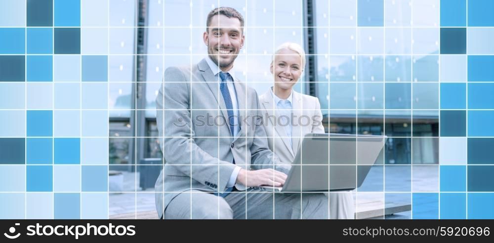 business, education, technology and people concept - smiling businesspeople working with laptop computer on city street over blue squared grid background