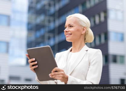 business, education, technology and people concept - smiling businesswoman working with tablet pc computer on city street