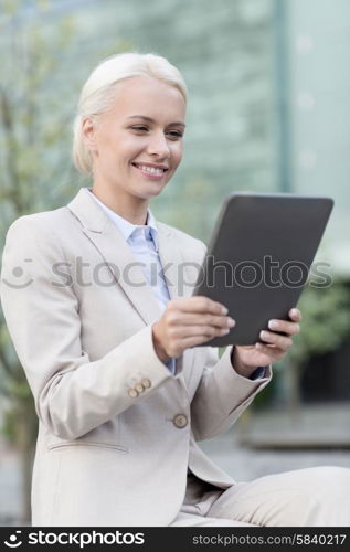 business, education, technology and people concept - smiling businesswoman working with tablet pc computer on city street