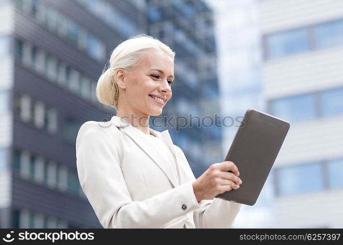 business, education, technology and people concept - smiling businesswoman working with tablet pc computer on city street