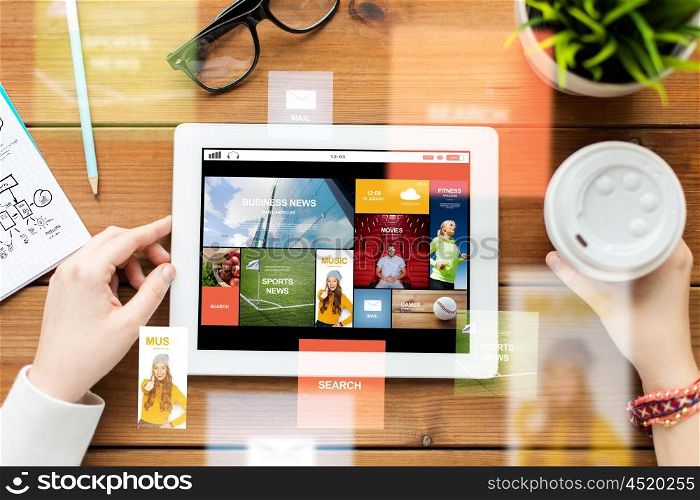 business, education, technology, people and mass media concept - close up of woman with internet news application on tablet pc computer screen and coffee on wooden table