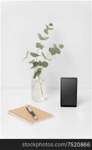 business, electronics and interior concept - smartphone with black screen on white office table. smartphone with black screen on white office table