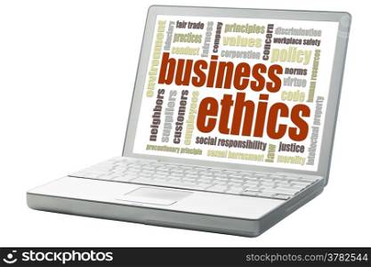 business ethics concept - a related word cloud on an isolated laptop