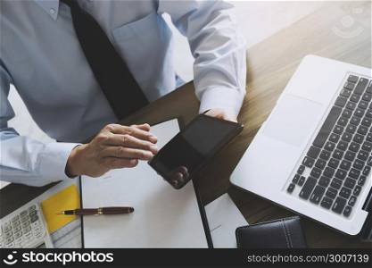 business executive auditor using tablet for data report investment