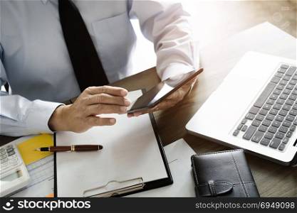 business executive auditor using tablet for data report investment