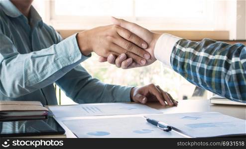 business executive colleagues hand shake valuation deal agreement