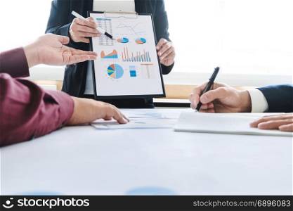 business executive colleagues working together with analysis data documents at a office