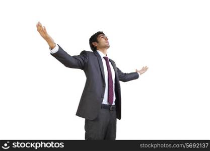 Business executive enjoying with arms outstretched