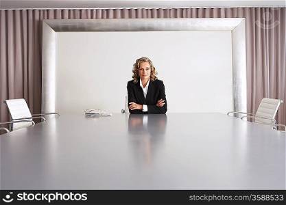 Business Executive Sitting in Boardroom