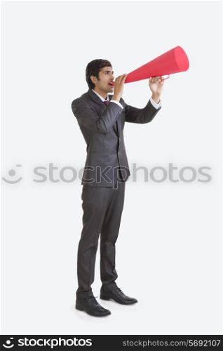 Business executive speaking through a loud speaker