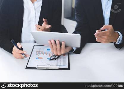Business executives adviser using digital tablet at a workplace