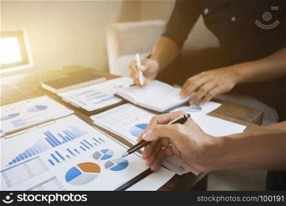 Business executives analyzing on valuation data paper