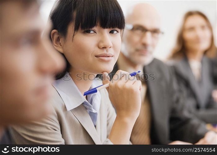 Business executives at a meeting in a board room