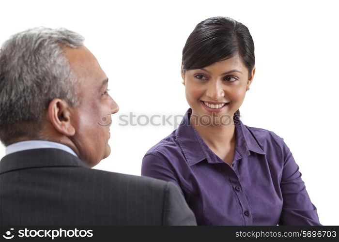 Business executives conversing on white background