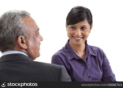 Business executives conversing on white background