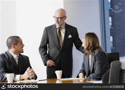 Business executives discussing in a board room