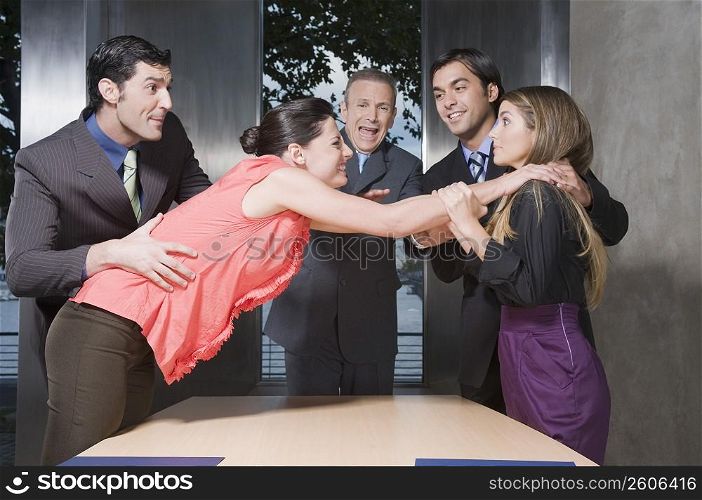 Business executives fighting with each other