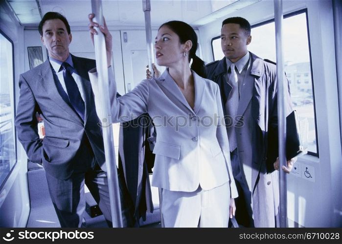 Business executives in a subway train