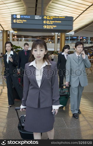 Business executives leaving an airport