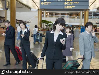Business executives leaving an airport