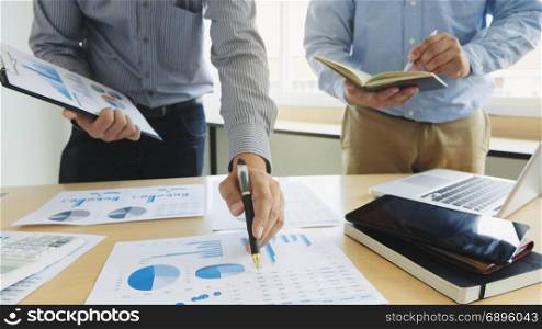 Business executives partner analysis data document with accountant at workplace