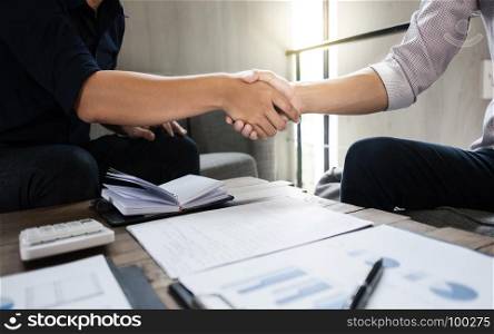 business executives partnership hand shaking