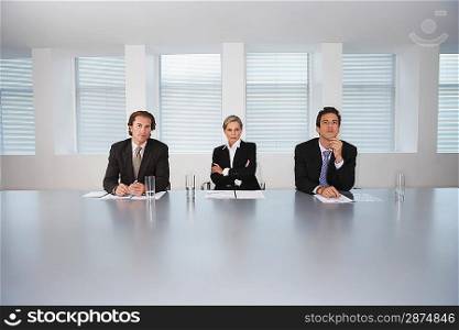 Business Executives Sitting in Conference Room