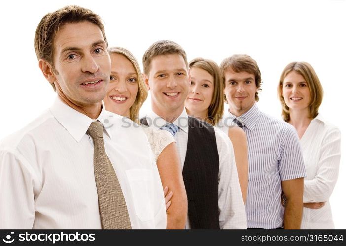 Business executives standing in a row and smiling