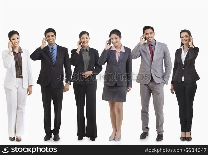 Business executives talking on a mobile phone