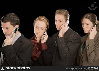 Business executives talking on mobile phones