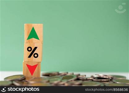Business finance and banking investments economy stack coin inflation and arrow red and green with wood cube on desk.