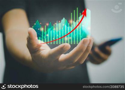 Business finance and investment concept Stock Market and Cryptocurrency Investment Graphs and charts on hand metaveres technology modern