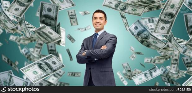 business, finance, investment, economy and people concept - happy businessman over dollar cash money rain and green background