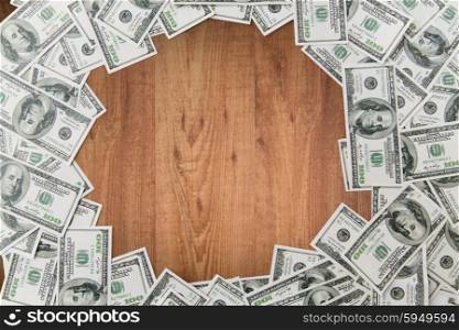 business, finance, investment, saving and corruption concept - close up of dollar money on wooden table background