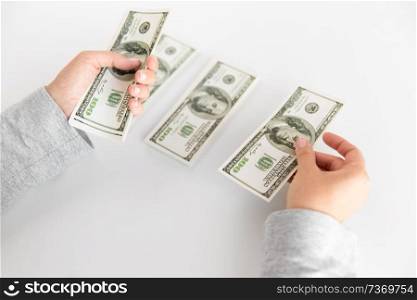 business, finance, saving and people concept - close up of woman hands counting us dollar money. close up of woman hands counting us dollar money