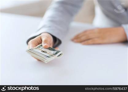 business, finance, saving, banking and people concept - close up of woman hands holding us dollar money