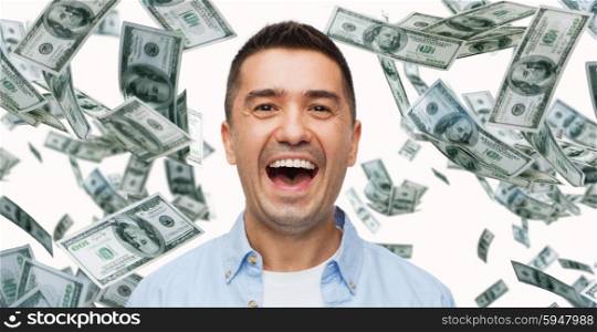 business, finance, success, emotions and people concept - laughing man with heap of falling dollar money
