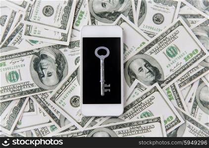 business, finance, technology and security concept - close up of smartphone with black blank screen, key and dollar money