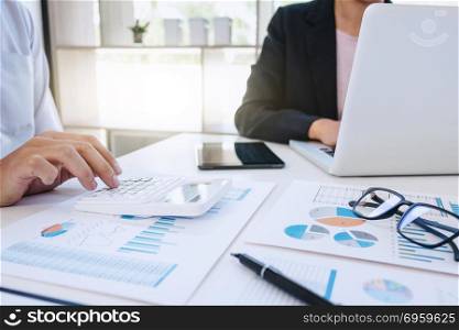 Business financier analysis data document with accountant using calculator. Business financier analysis data document with accountant using