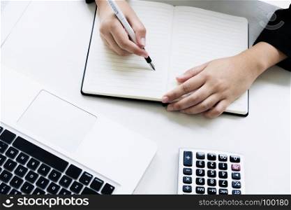 business financier audit working with laptop and calculator