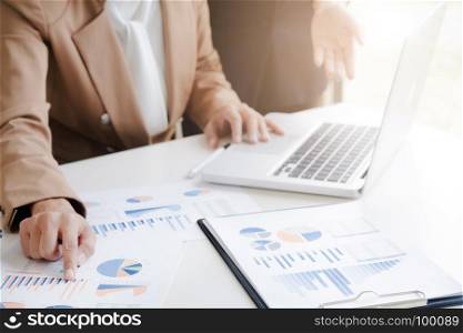 business financier audit working with laptop and data annual report
