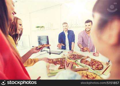 business, food, lunch and people concept - happy international business team eating pizza in office. happy business team eating pizza in office