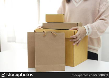 Business From Home woman preparing package delivery box Shipping for shopping online. young start up small business owner at home online order