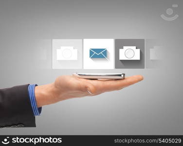 business, future technology and internet - hand with smartphone showing instant picture application